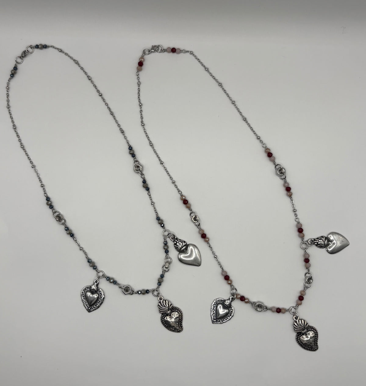 Collana TreCuori in acciaio con cuori sacri e cristalli
